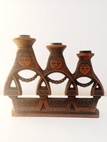 Iparművészeti bronz Matryoshka gyertyatartó.