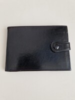 Új fekete, vajszínű belsejű bőr pénztárca, mérete 13x9cm, kinyitva 25cm