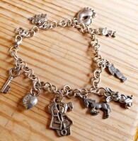 Retro fém karkötő zsuzsukkal, charmokkal