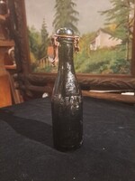 ANTIQUE MINI CROWNED EMBLEM GLASS BOTTLE, ABOUT 2 DL.
