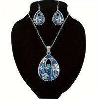 KÜLÖNÖSEN SZÉP KÉK SZÍNŰ NAGYON SZÉP FÉNYES MINDENHOL A TŰZZOMÁNC ÉKSZER SZETT,KRISTÁLY KŐ DÍSZÍTI.