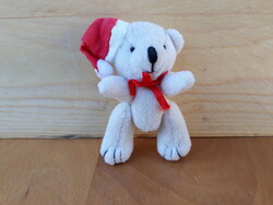 Kicsi fehér Maci Mikulás sapkában