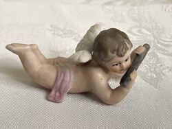 Tündéri nagyon szépen festett porcelán puttó gyűjteménybe való.