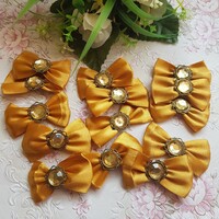 Gold colored satin bow ornament, decoration