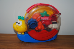 FISCHER PRICE FORMAILLESZT, ZENÉLŐ CSIGA BABA-, GYEREKJÁTÉK