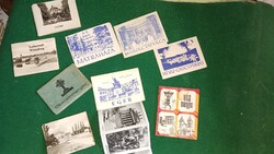 Régi retró turista brosúrák városokról, fotókkal