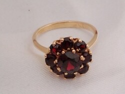 Női arany gyűrű gránát kövekkel