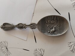 Old ornate tin spoon