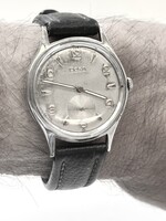 1950s watch freshly serviced by Doxa, featuring luminous phosphorescent hands, thick leather strap, 34.91 mm