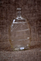 Vintage glass bottle flask with relief decoration