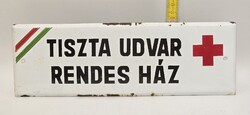 Clean yard, neat house, old enamel sign