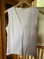 Baty fashion márkájú L-es méretű jersey ujnélküli fehér bluz,top.Mellbőség 96 cm Háta hossza: 58 cm