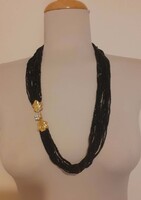 Stunning multi-strand black necklace with tiny glass beads and an eye-catching clasp