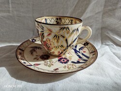 Immaculate, antique Zsolnay cup with family crest and bamboo pattern.