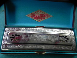 Antik Hohner Preciosa szájharmonika, amely az eredeti, kék belsejű dobozában