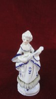 Hand-painted porcelain, cobalt blue decorated singing girl in lace-edged dress. Vanneki!