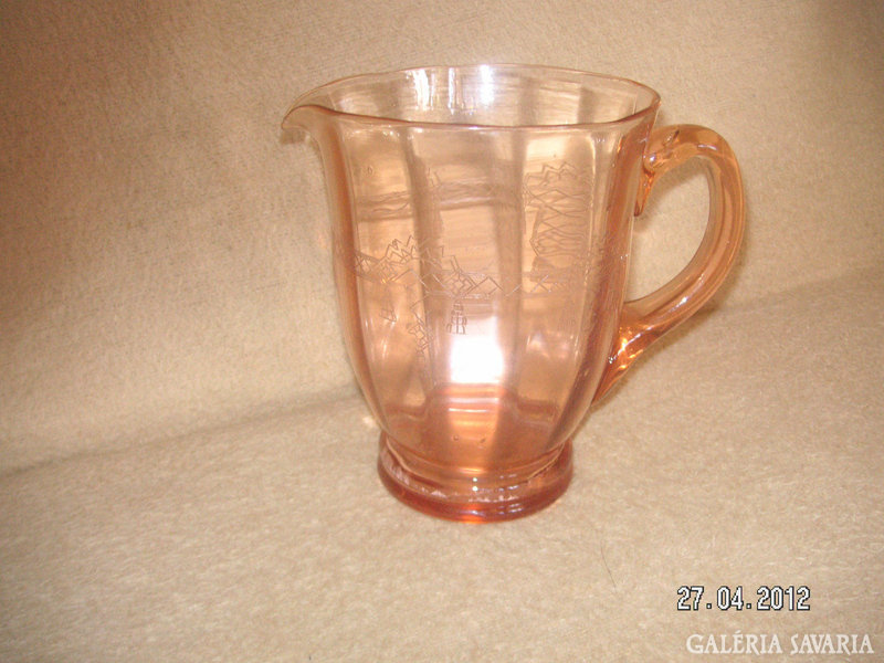 Glass jug, peach-colored, with a polished art deco pattern on the side. 18 Cm