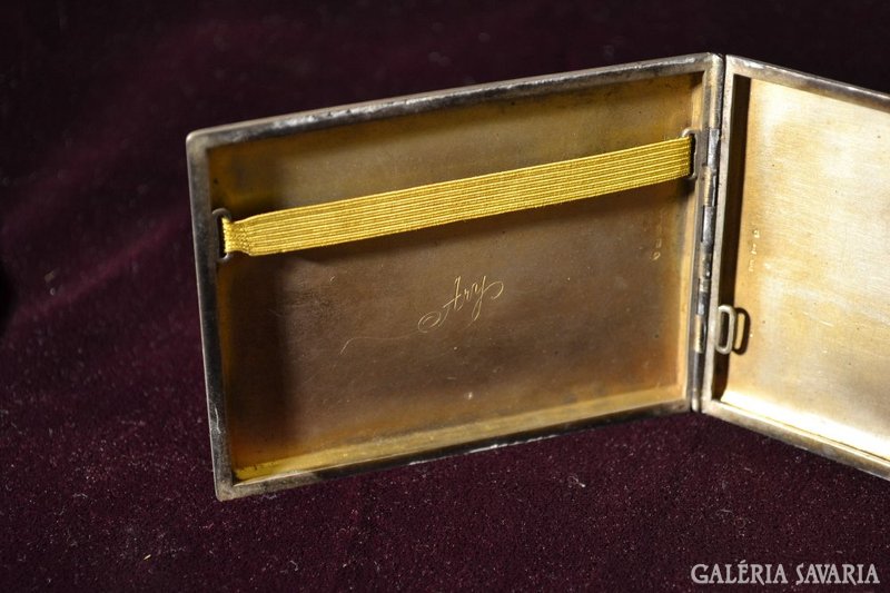 Silver cigarette case.