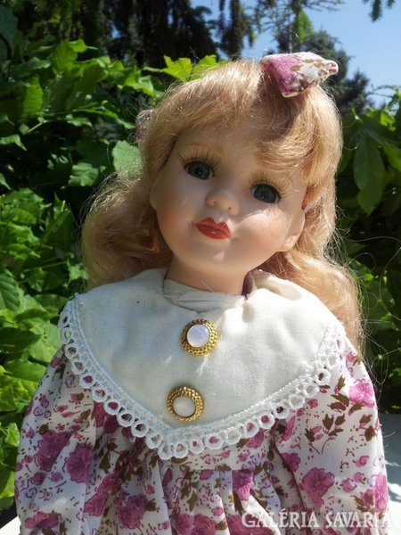 Doll with blonde porcelain head.