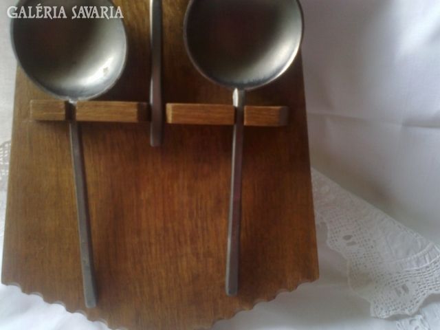 Old wooden spoon holder with spoons