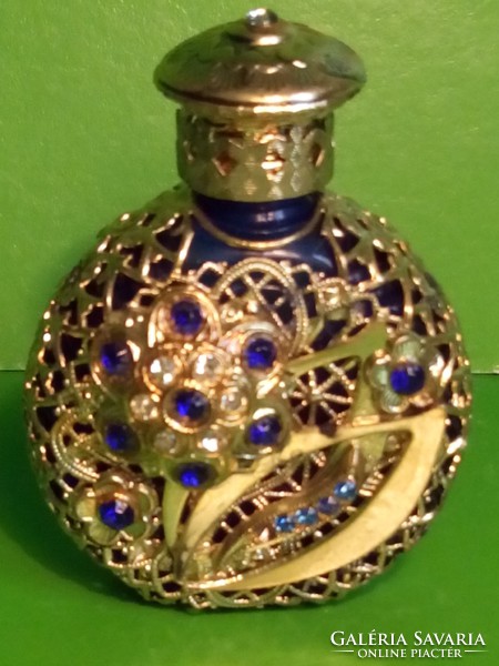 Antique perfume cologne bottle with copper decoration