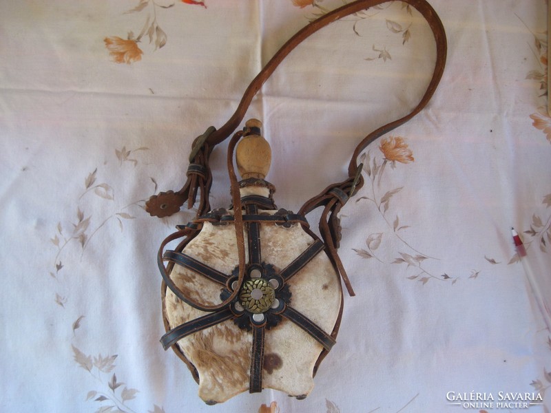 Water bottle, colt leather, very old, covered with leather, decorative, battered 15 x 17 cm