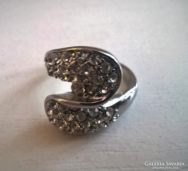 Silver-plated fashion ring in good condition, studded with small stones