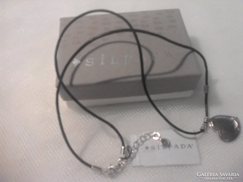 Silver pendant with black leather chain