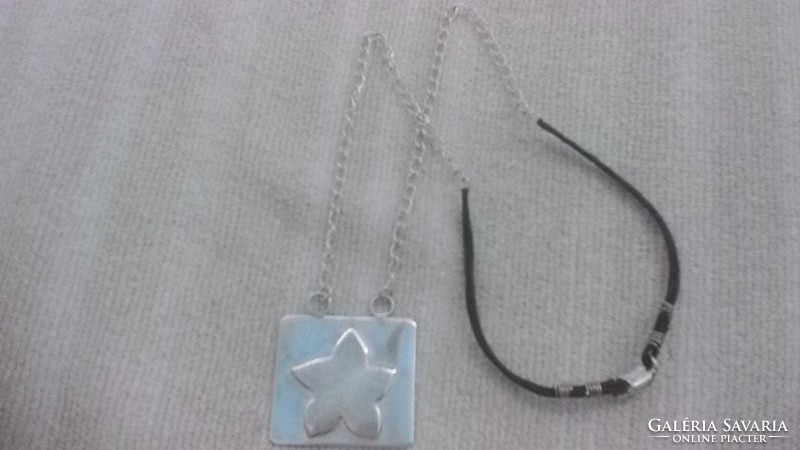 Silver pendant with silver and black leather chain