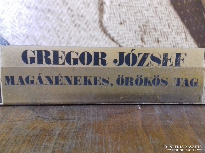 József Gregor theater or cinema poster on a wooden board