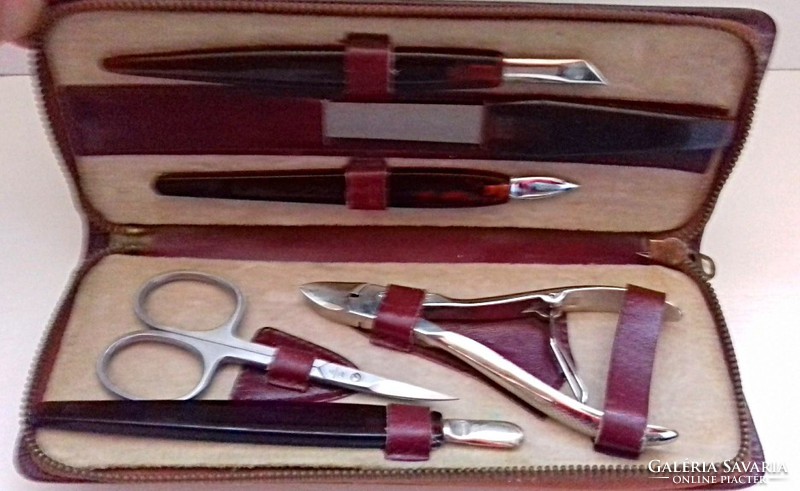 Old manicure set in a nice condition in a leather case.