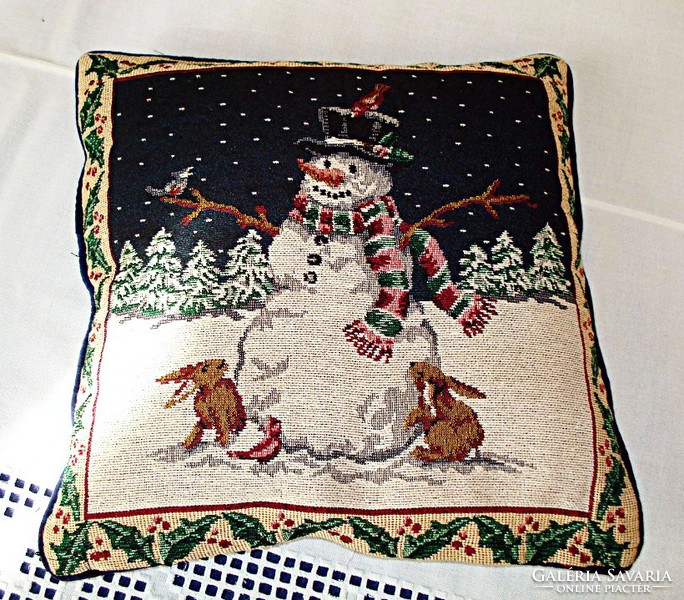 Tapestry cushion decorated with snowmen and bunnies