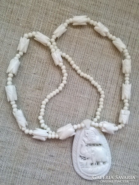 Old carved bone necklace in good condition