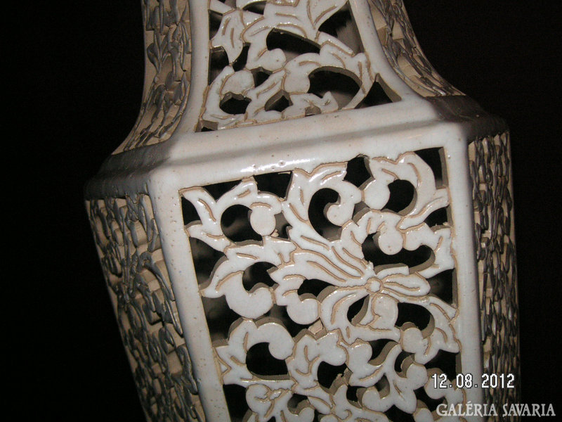 A large openwork vase, without a mark, (perhaps fischer) can be a nice decoration for the apartment