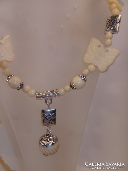 Bone necklace with butterfly carving (554)