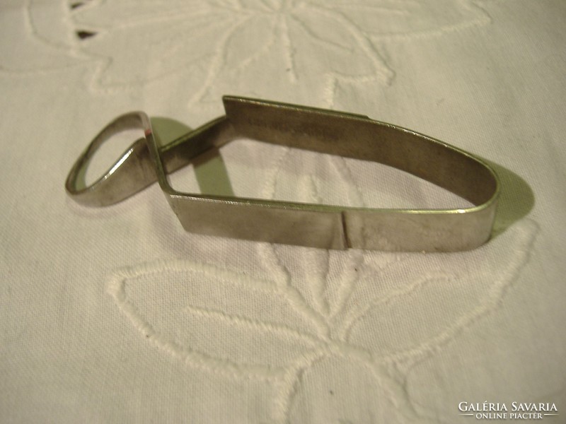 Old, stainless sheet clip. No longer in use.