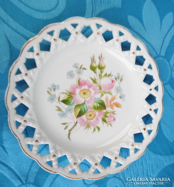 Antique flower-patterned Austrian decorative plate with an openwork basket weave pattern on the rim.
