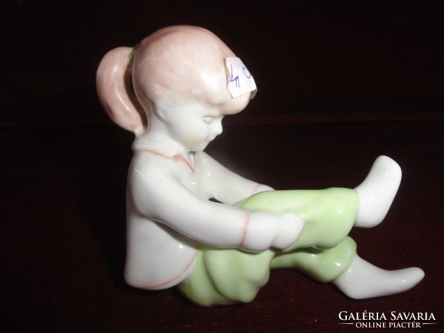 Aquincum porcelain figural statue, little girl getting dressed. He has! Jokai