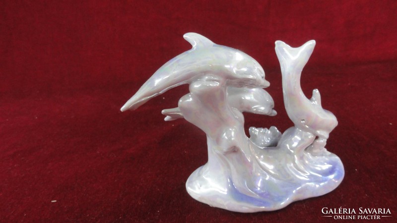 Porcelain light blue dolphin with 3 dolphins. He has!