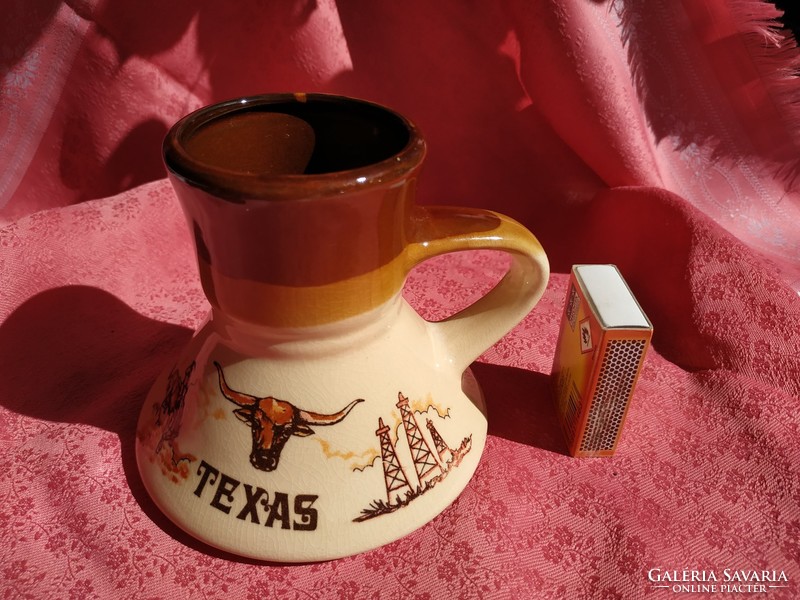 An interesting ceramic jug with a Texas handle