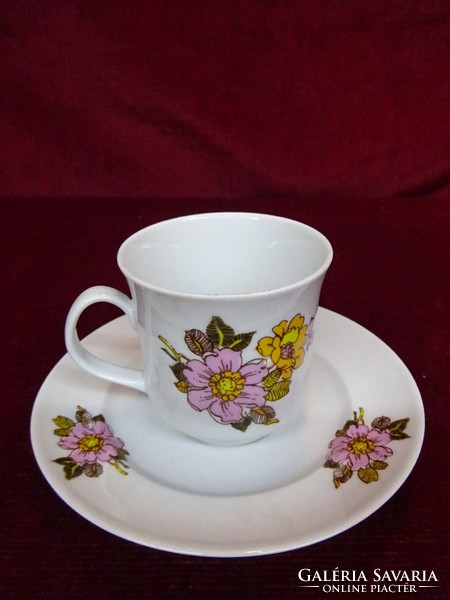 Lowland porcelain coffee cup + placemat. With pink floral pattern. He has!