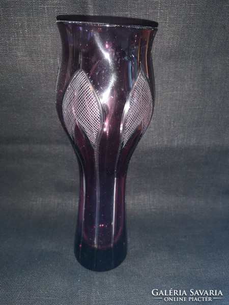 The purple crystal vase is polished and in perfect condition