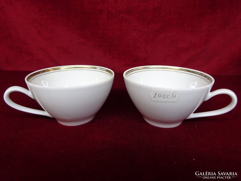 Kahla German porcelain teacup with snow white thick gold border. He has!