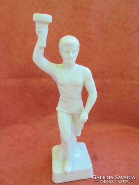 Porcelain statue holding a rare raven house Olympic flame