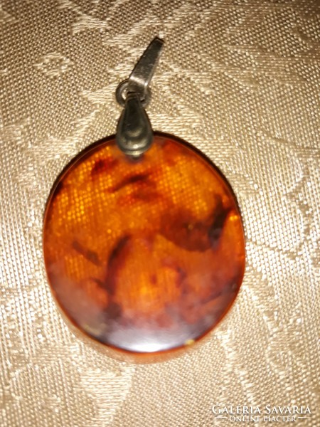 Russian amber pendant with silver clasp