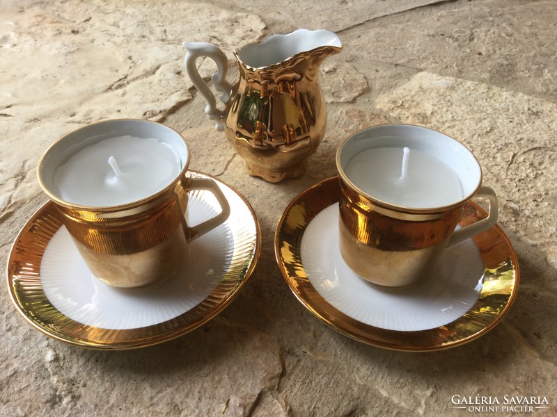 Gold-plated Bavarian porcelain coffee cup and saucer in a pair of gift scented candles with cream spout