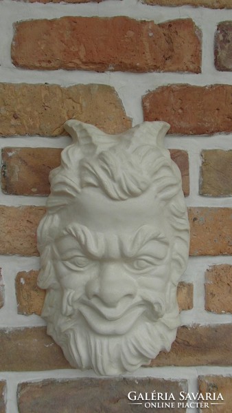 Pan head wall decoration made of artificial stone