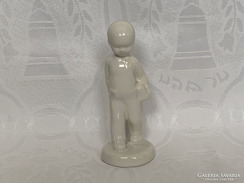 Porcelain boy with book, 13 cm. Unpainted and unmarked