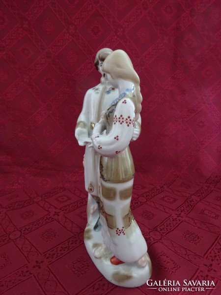Russian porcelain figurine, a couple in love in folk costume, height 25 cm. He has!
