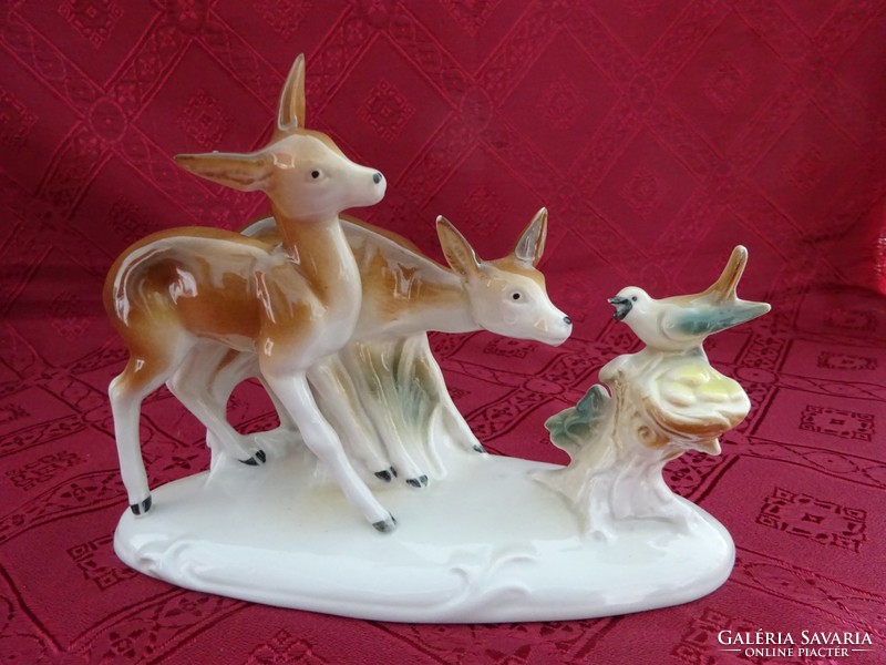 German porcelain figurine, deer with the little bird. Length 18.5 cm. He has!